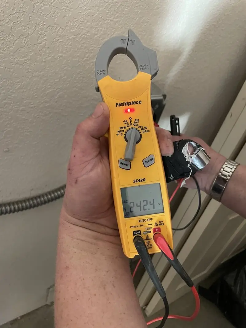 Voltage testing with clamp meter during Circuit Breaker Repair in Bedford